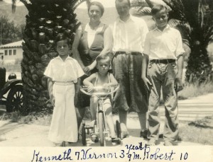 Vernon James (on tricycle) with his brothers and his parents. (1931)